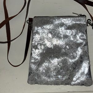 sliver acid washed cowhide cross body.